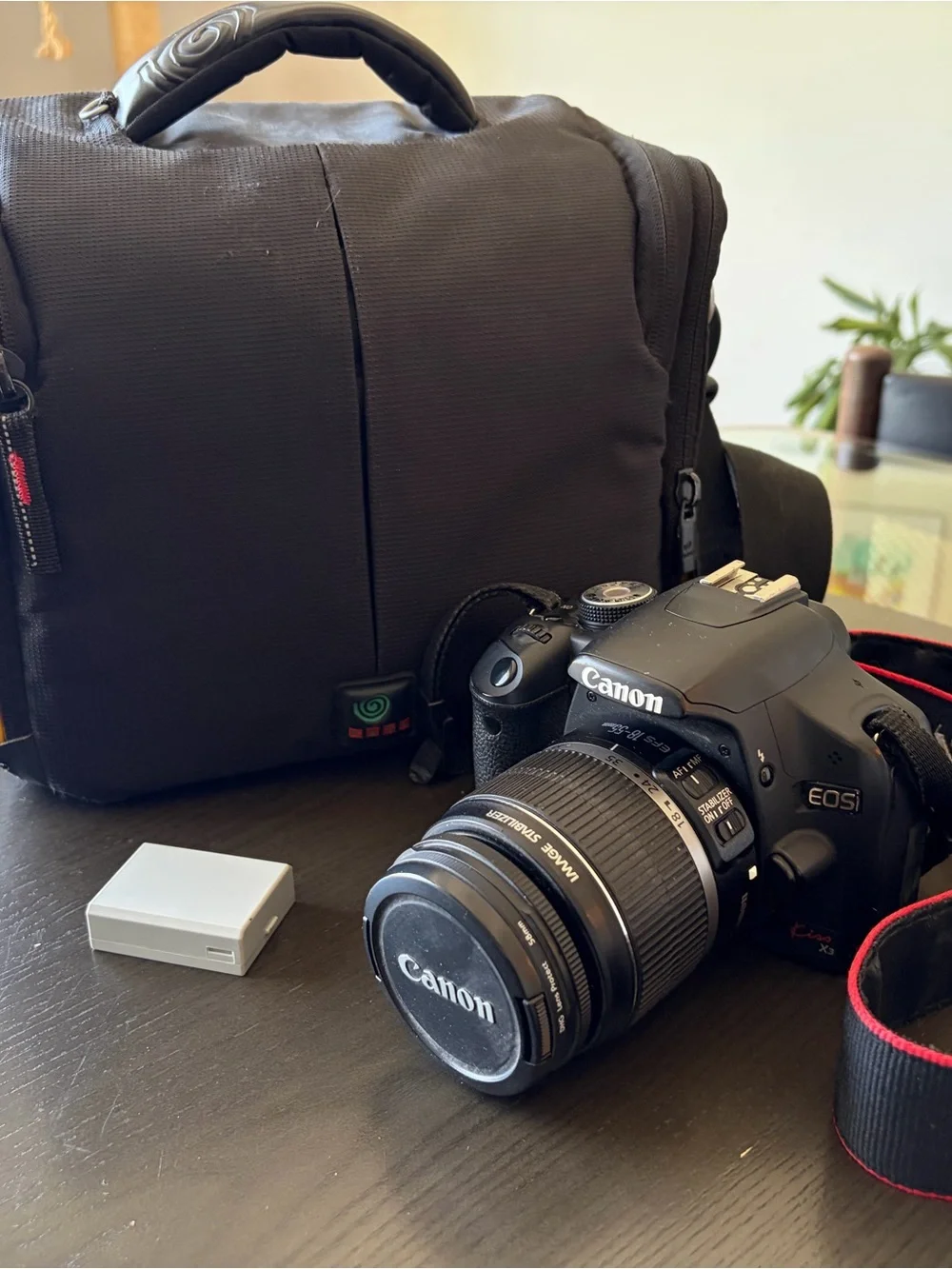 Canon EOS Rebel XSi DSLR Camera in Black with Red-Trim Strap